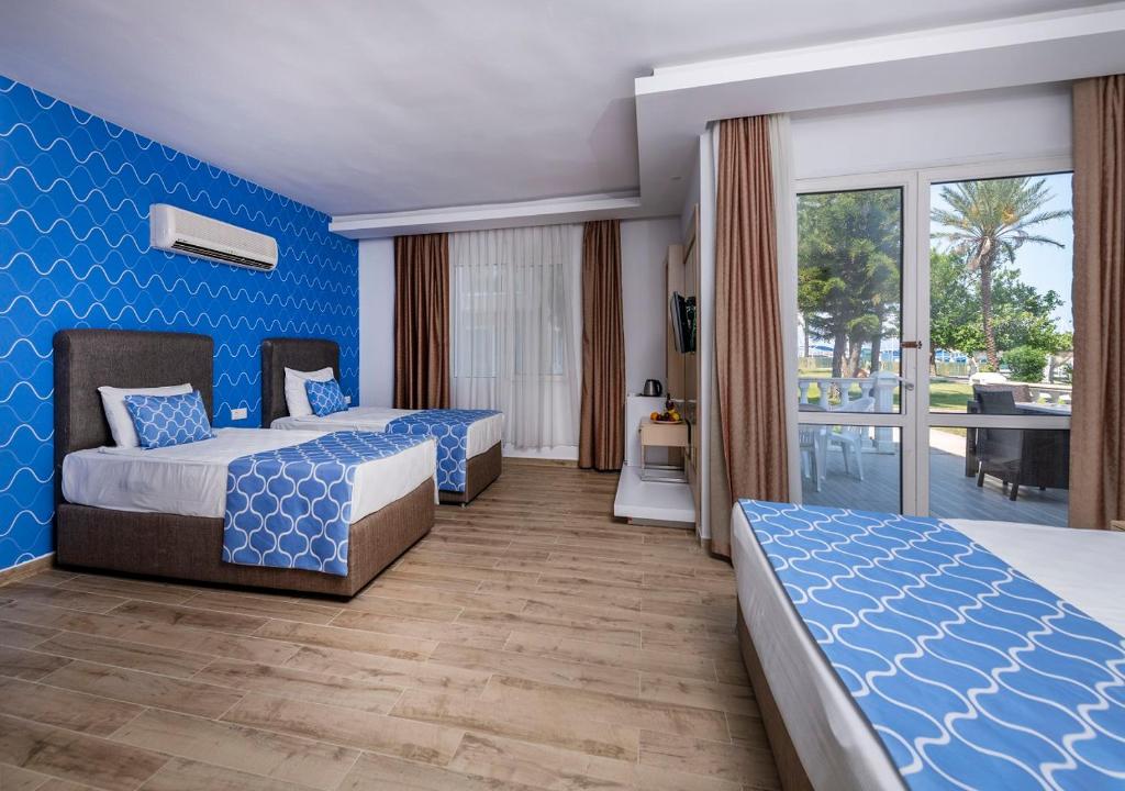 08-اتاق-هتل-5-ستاره-لوکسیا-کامفورت-ریزورت-کمر- Loxia-Comfort-Resort-Kemer-Hotel-Room.jpg