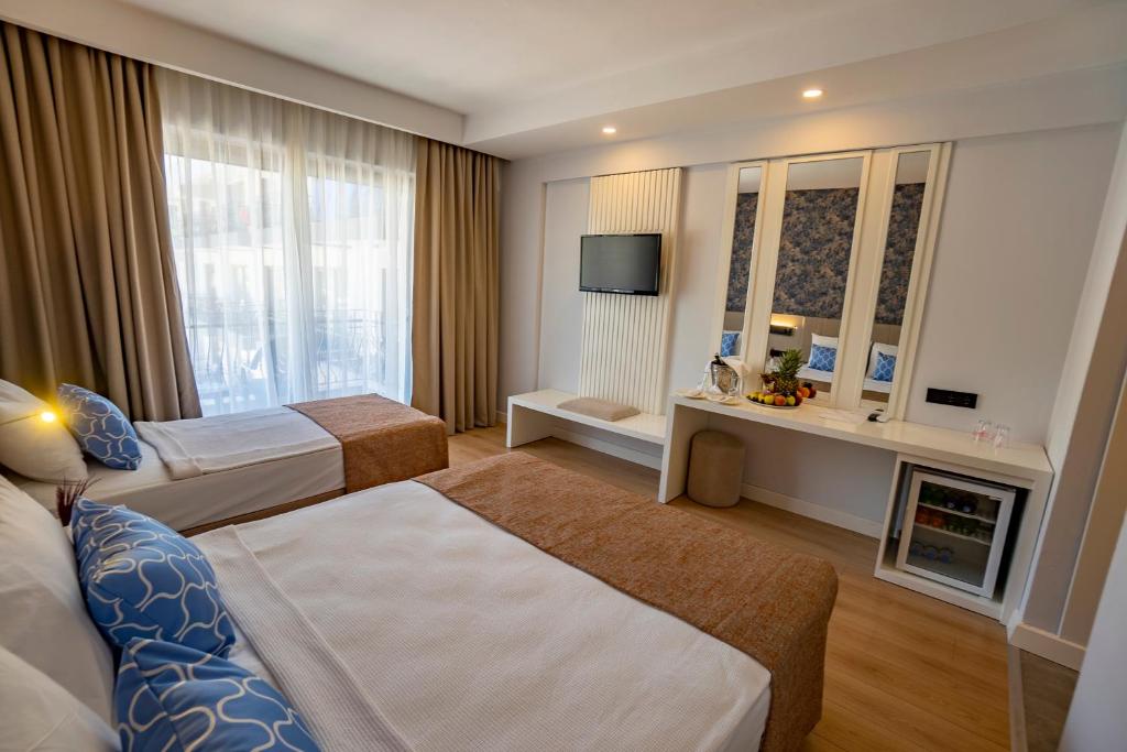 03-اتاق-هتل-4-ستاره-الدار-گاردن-ریزورت-آنتالیا- Eldar-Garden-Resort-Antalya-Room.jpg